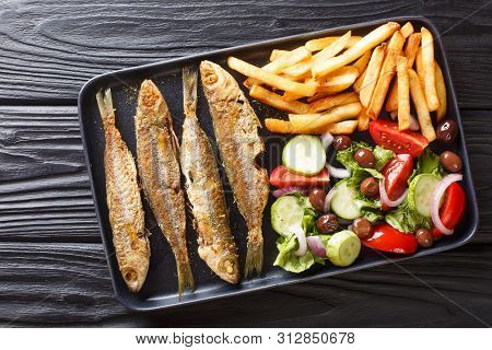 Fresh Fried Boops Boops Fish With Summer Vegetable Salad And French Fries Close-up On A Plate. Horiz
