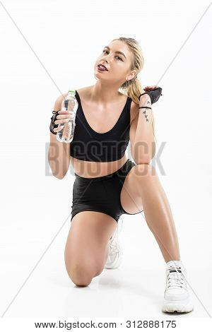 Woman After Sport Drinking Water From Bottle