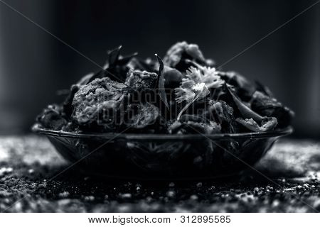 Famous Indian & Gujarati Snack Dish In A Glass Plate On Wooden Surface I.e. Patra Or Paatra Consisti