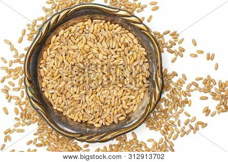 Lot Of Whole Raw Fresh Beige Dinkel Wheat Grain In Old Iron Bowl Flatlay Isolated On White Backgroun