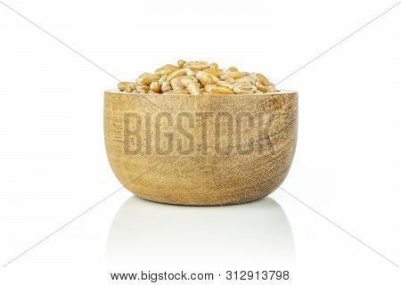 Lot Of Whole Uncooked Fresh Beige Dinkel Wheat Grain In A Wooden Bowl Isolated On White Background