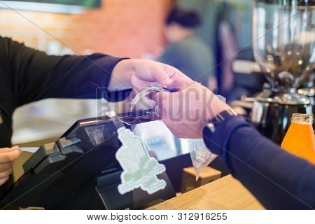 Cashier Take Banknote From Consumer Hand. Hand Paying Money To Worker In Coffee Shop. Saleswoman Rec