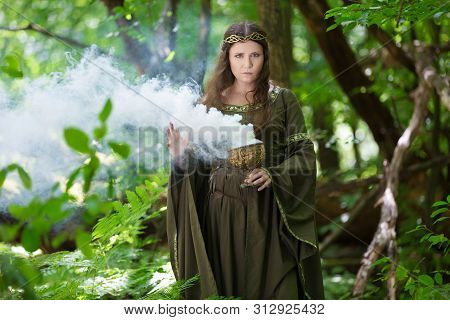 Elf Performing Spells In The Forest With Magical Smoke