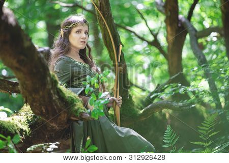 Elf Archer With A Bow In The Forest