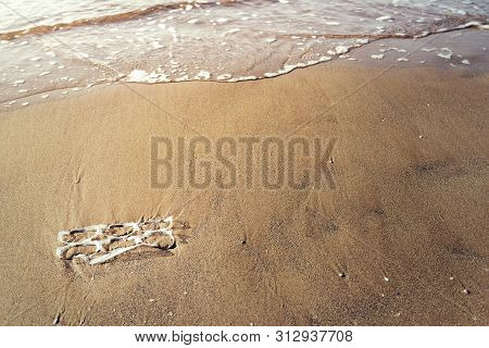 Background Of A Plastic Rings Lies On The Shore Of The Beach And Pollutes The Sea And The Marine Lif