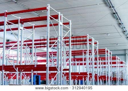 Row Of Mpty Warehouse Racks, Empty Metal Shelf In Storage Room