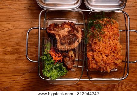 Potatoes And Meat On A Baking Tray
