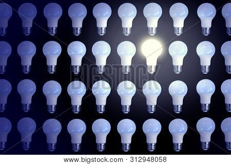 Personality Among The Crowd. Concept With One Switched On Lighting Bulb Among Switched Off Bulbs. No