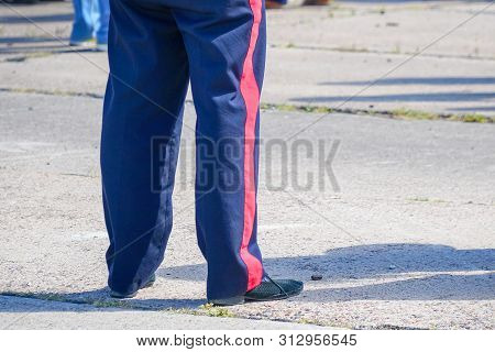 Blue Trousers With A Red Stripe On The Military Man. The Stripes On The Pants