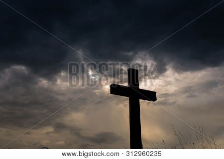 Silhouette Of A Simple Catholic Cross, Dramatic Stormclouds After Heavy Rain, Copy Space.