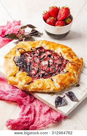 Homemade Strawberry Open Pie Gallet With Purple Basil And Balsamic Dressing On A Light Background.