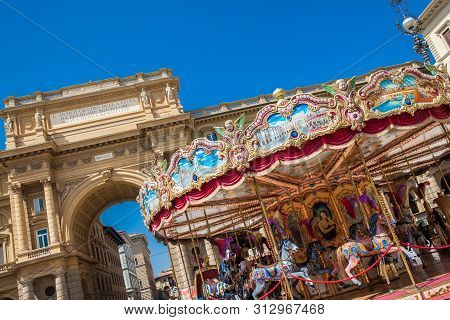 Florence, Italy - April, 2018: Tourists And Locals At The Republic Square Next To The Carrousel And