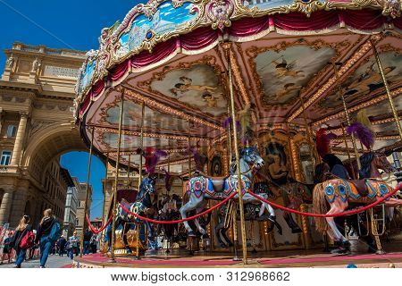 Florence, Italy - April, 2018: Tourists And Locals At The Republic Square Next To The Carrousel And