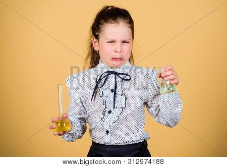 Stressed And Tired Doctor. Small Stressed Girl With Testing Flask. Child Study Bilogy Lesson. Back T