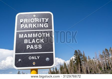 Mammoth Lakes, California - July 12, 2019: Sign For Priority Parking - Mammoth Black Pass For Pass H