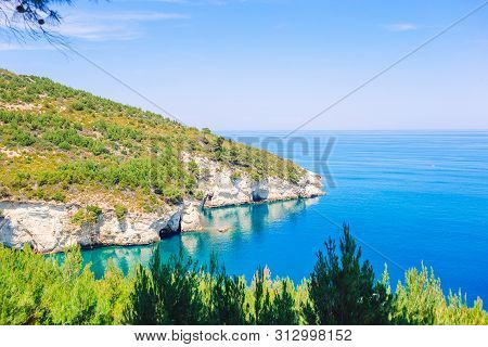 Beautiful Cozy Bay With Boats And Clear Turquoise Water In Italy