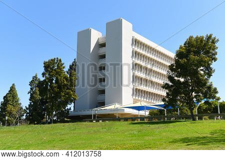 IRVINE, CALIFORNIA - 22 APRIL 2020: Social Science Tower on the campus of the University of California Irvine, seen from Aldrich Park.