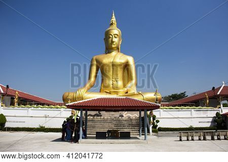 Golden Big Buddha Statue Of Wat Bang Chak At Riverside Chao Phraya River Near Koh Kret Island For Th
