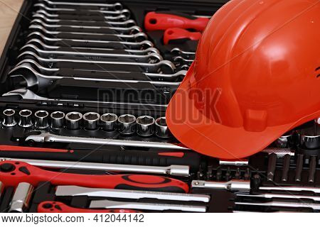 Toolbox, Tools Kit Detail And Orange Protective Helmet Close Up. Instruments. Set Of Tools. Car Tool