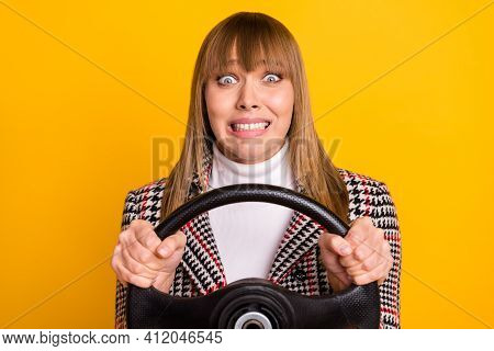 Portrait Of Horrified Person Hands Holding Steer Teeth Grin Look Camera Isolated On Yellow Color Bac