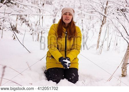 Beautiful Sexy Girl Tosing Snow. Around The Trees In The Snow