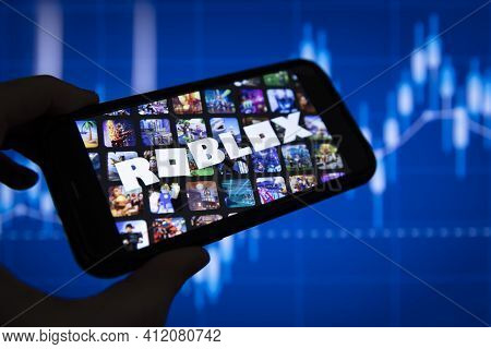 London, Uk - March 2021: Roblox Game Logo In Front Of Stock Market Chart