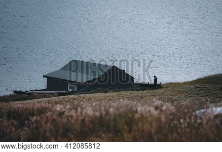Bour Village Grass-covered Picturesque Houses At The Faroese Coastline In The Village Bour With View