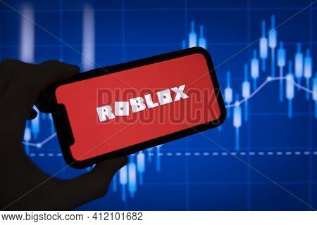 London, Uk - March 2021: Roblox Game Logo In Front Of Stock Market Chart