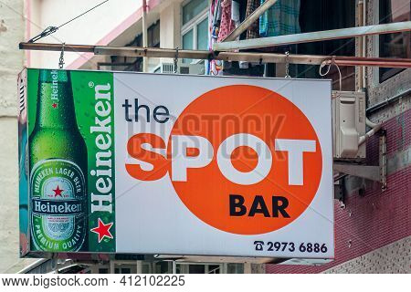 Hong Kong Island, China - May 14, 2010: The Spot Bar Sign With A Large Orange Circle And The Image O