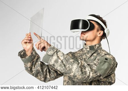 Military using transparent tablet with VR headset