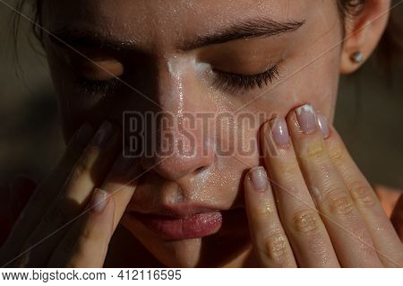 Skincare. Woman Washing Face With Cleancing Gel. Acne Protection