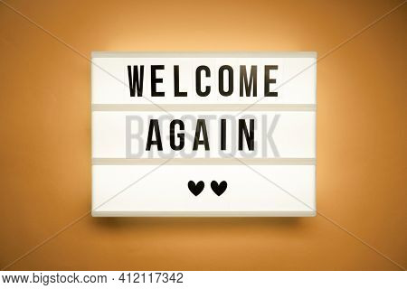 Lightbox with text open again. Concept of the end of pandemia.