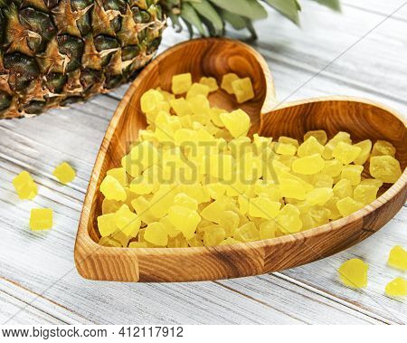Sweet Pineapple Succade Cubes On White Wooden Background