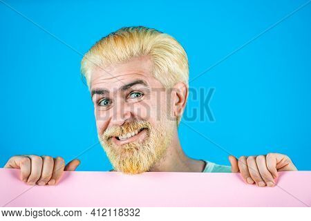 Man Holding Empty Placard Board For Media Banner. Sale. Surprised Bearded Man Holding Empty Paper