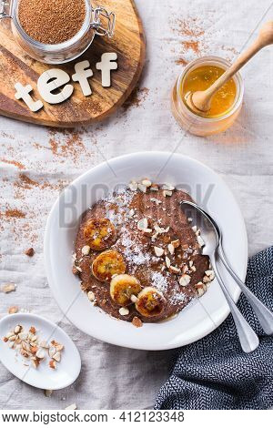 Teff Grain Porridge With Banana Topping For Breakfast