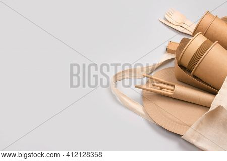 Eco-friendly Tableware - Kraft Paper Food Cups And Containers In Cotton Bag On Gray Background With 
