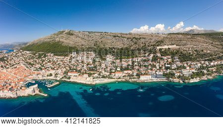 Aerial Drone Shot Of Dubrovnik Old Town Coastline At Foot Of Mountain Srd In Croatia Summer