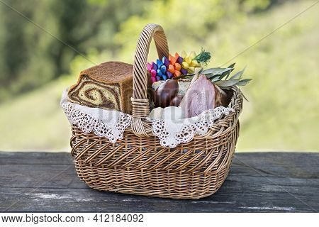 Easter Traditional Food With Ham, Eggs And Bread In Basket. Holidays Background Outdoor. Easter Bask