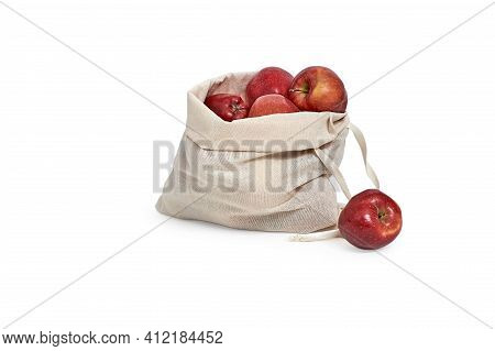 Red Apples Are Stored In A Natural Flax Bag. Isolated On A White Background. Autumn Products.