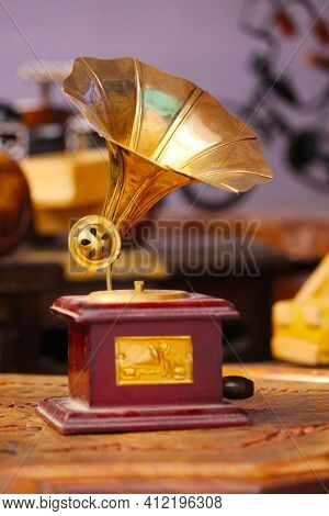 Old Gramophone With Horn Speaker Over Plates