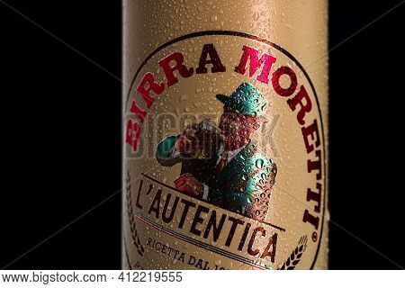 Birra Moretti, A Premium Lager Beer With Water Droplets On Black Background. Studio Photo Shoot In B