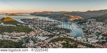 Aerial Panorama Drone Shot Of Lapad In Dubrovnik With Sunrise Over Hill Peak In Cruise Port In Croat