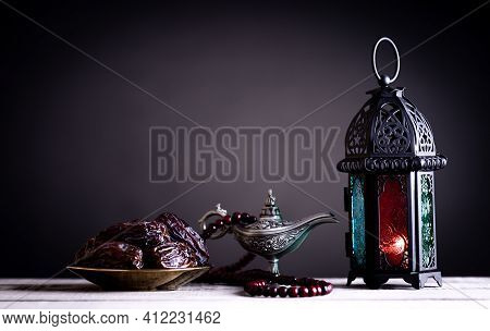 Ramadan Food And Drinks Concept. Date Fruits, Ramadan Lantern With Arabian Lamp And Wood Rosary On A
