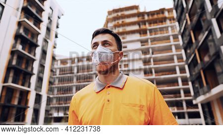 Construction Worker Wearing Safety Equipment. Kn 95 Mask. Corona Mask. Covid-19 Protective Respirato