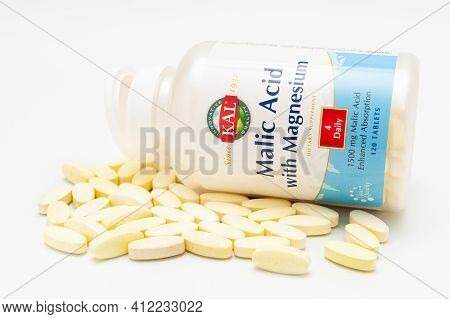 Kal - Malic Acid With Magnesium, Bottle With Scattered Tablets. Isolated On White Background. Close-