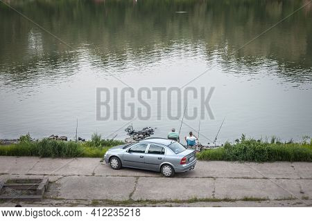 Szeged, Hungary - July 21, 2017: Two Men, An Old Senior Male And A Young One, Relaxed And Fishing On