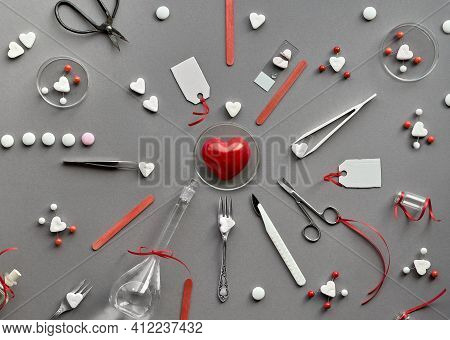 Chemistry Of Love. Creative Flat Lay On Grey Paper. Top View With Chemical Glassware, Petri Dishes, 