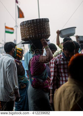 Unidentified Women And Men Trade In A Wide Variety Of Fish At One Of The Oldest Fish Market In Mumba