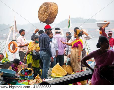 Unidentified Women And Men Trade In A Wide Variety Of Fish At One Of The Oldest Fish Market In Mumba
