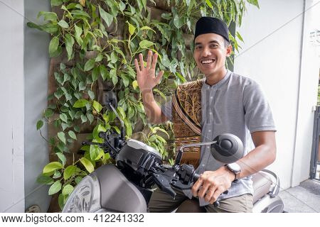 Muslim Male Going To The Mosque By Riding Motorbike